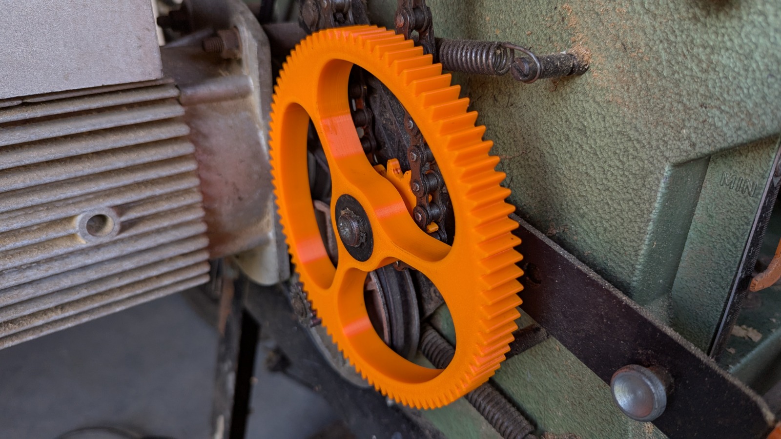3D printed replacement drive gear installed in wood planer machine